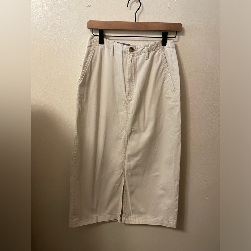 St. Johns Bay White skirt. size 6 waistband with button and zipper. Front slit.
